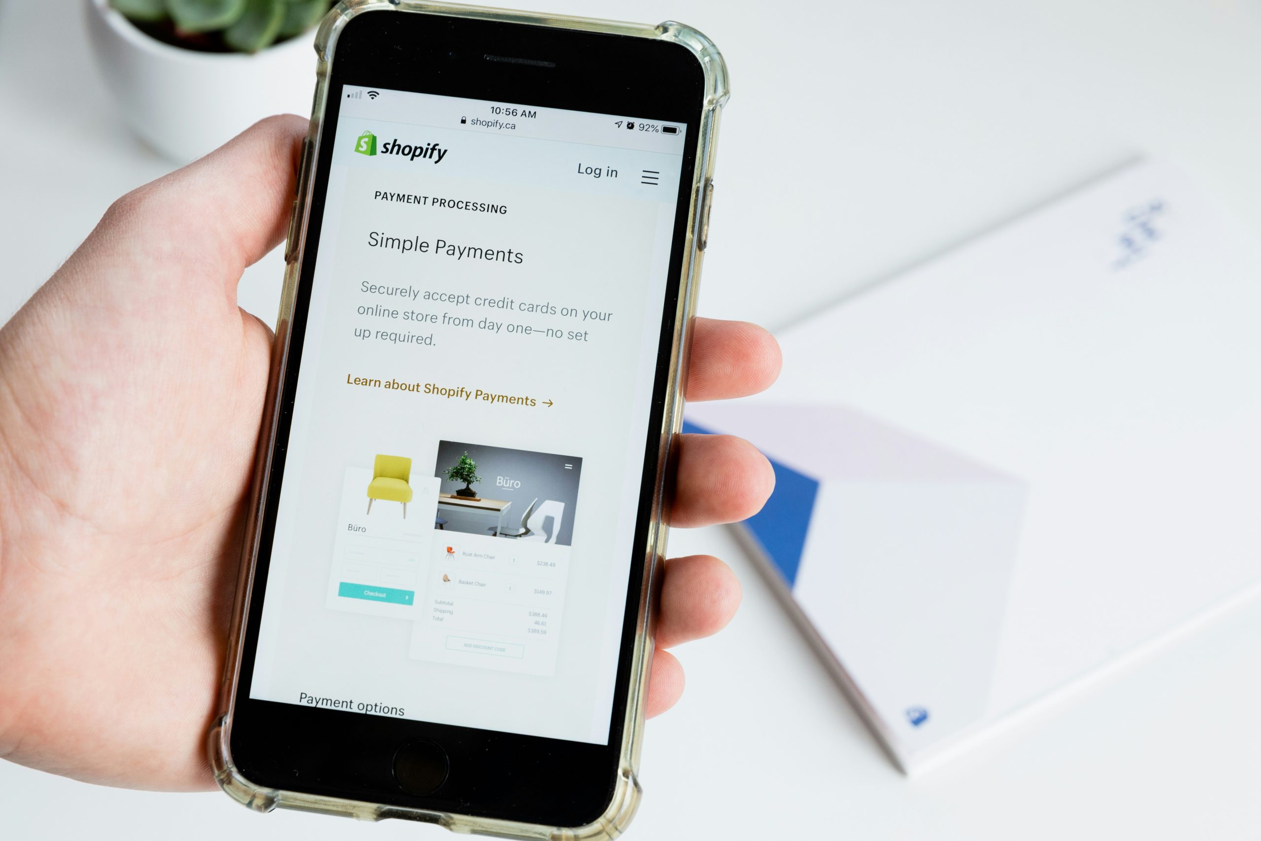 Shopify mobile version in the hand of a shopify shopper