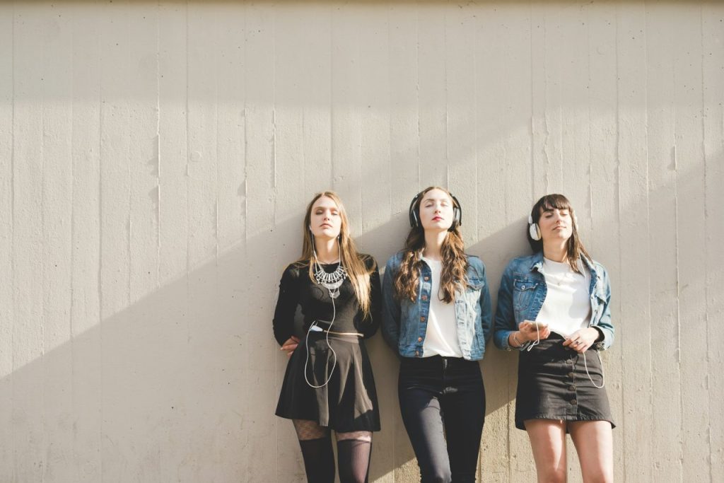 a group of women wearing headphones