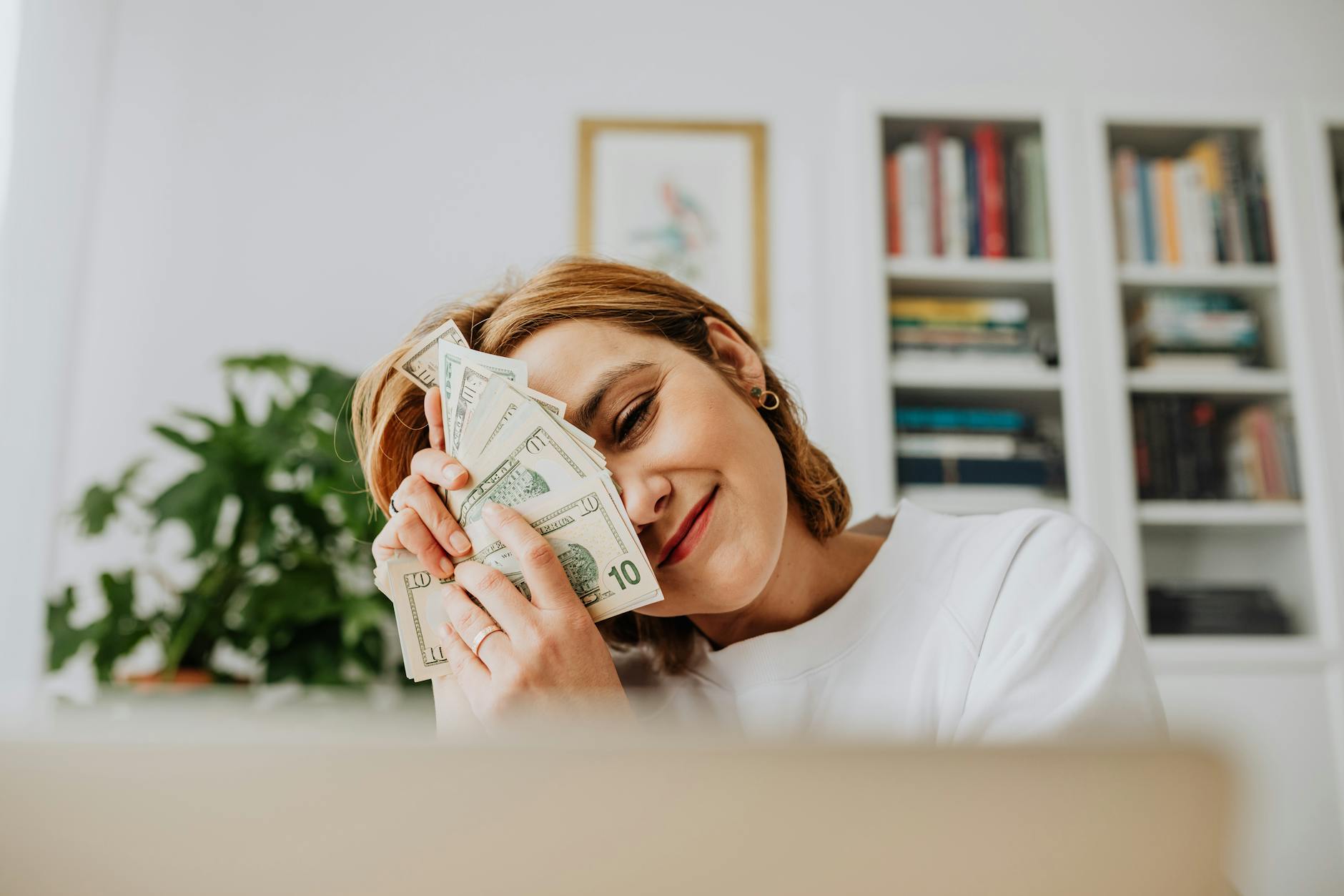 woman embracing money