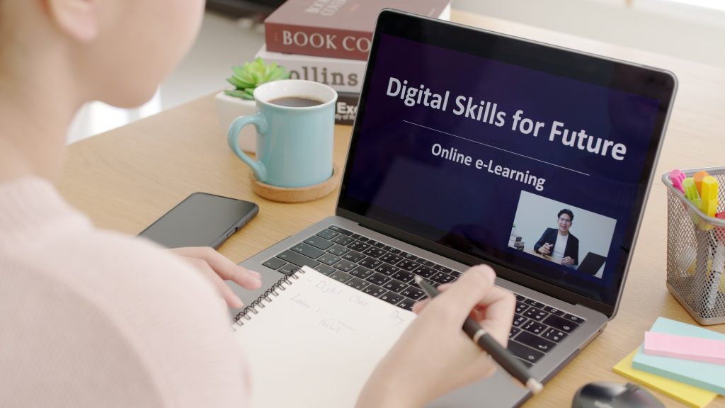 Rear view young asian woman listen watch digital class e-learning online for employee