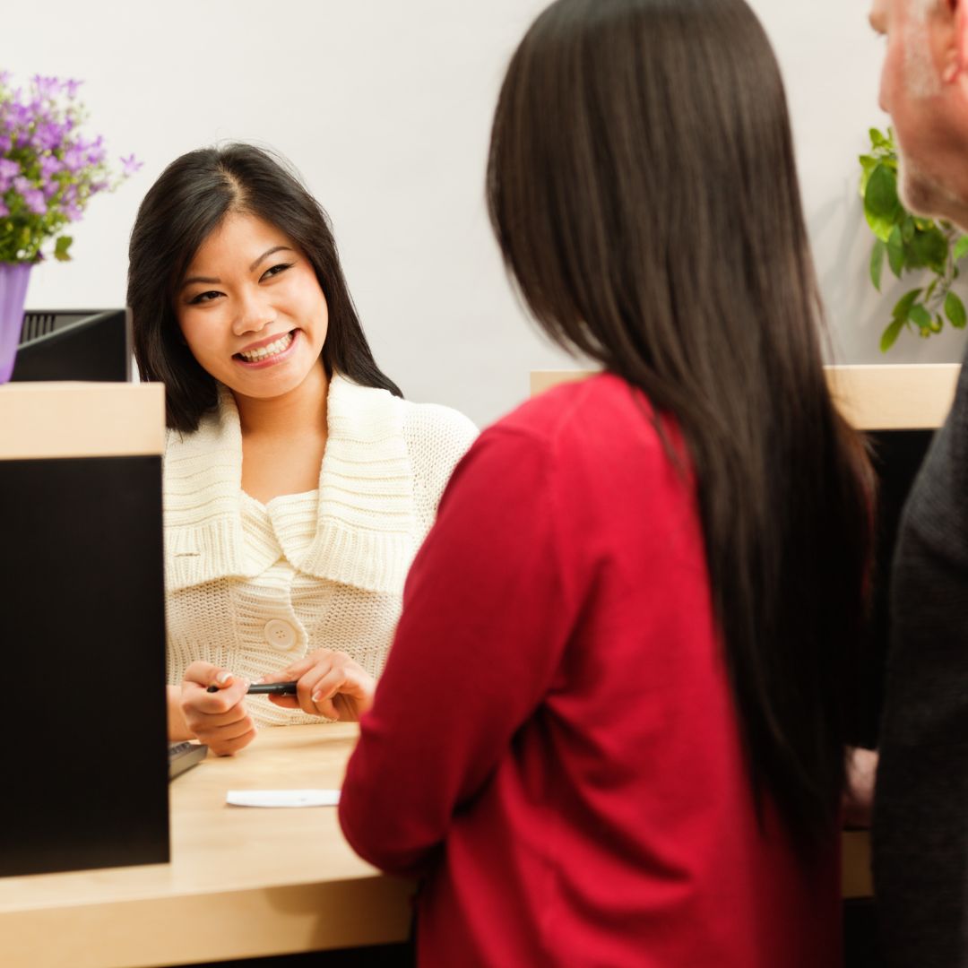 A couple sitting across the table from a banker