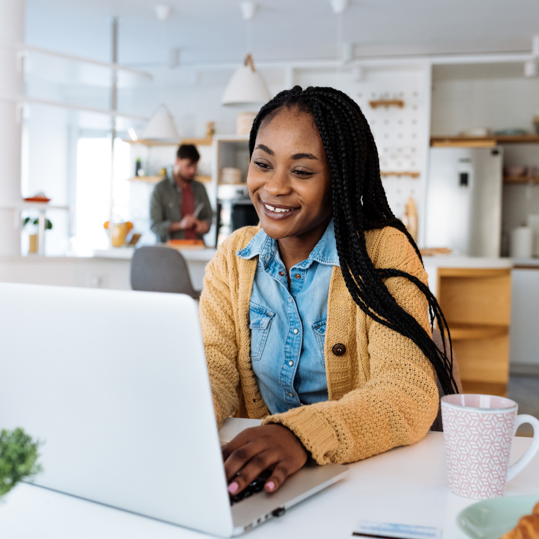 woman creating online course on a laptop.